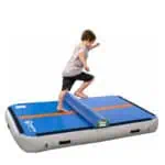 A boy jumps across a Half Round placed on a Power Launch
