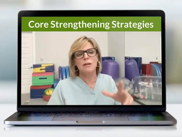 A photograph of a laptop with a webinar on the screen. Above the presenter are the words "Core Strengthening Strategies".